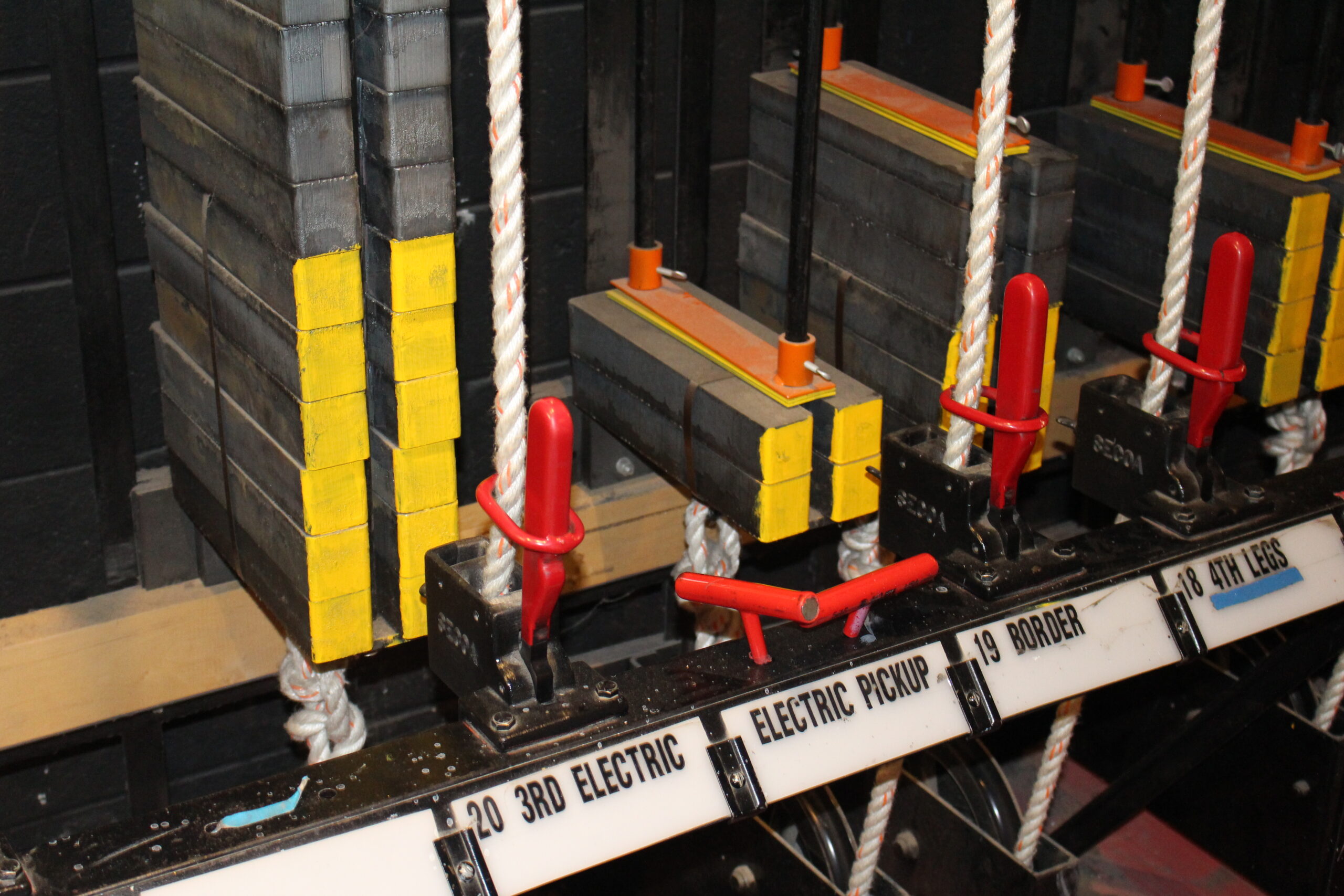 handles of a flyrail in a theaterical counterweight rigging system - Theater Rigging Inspection