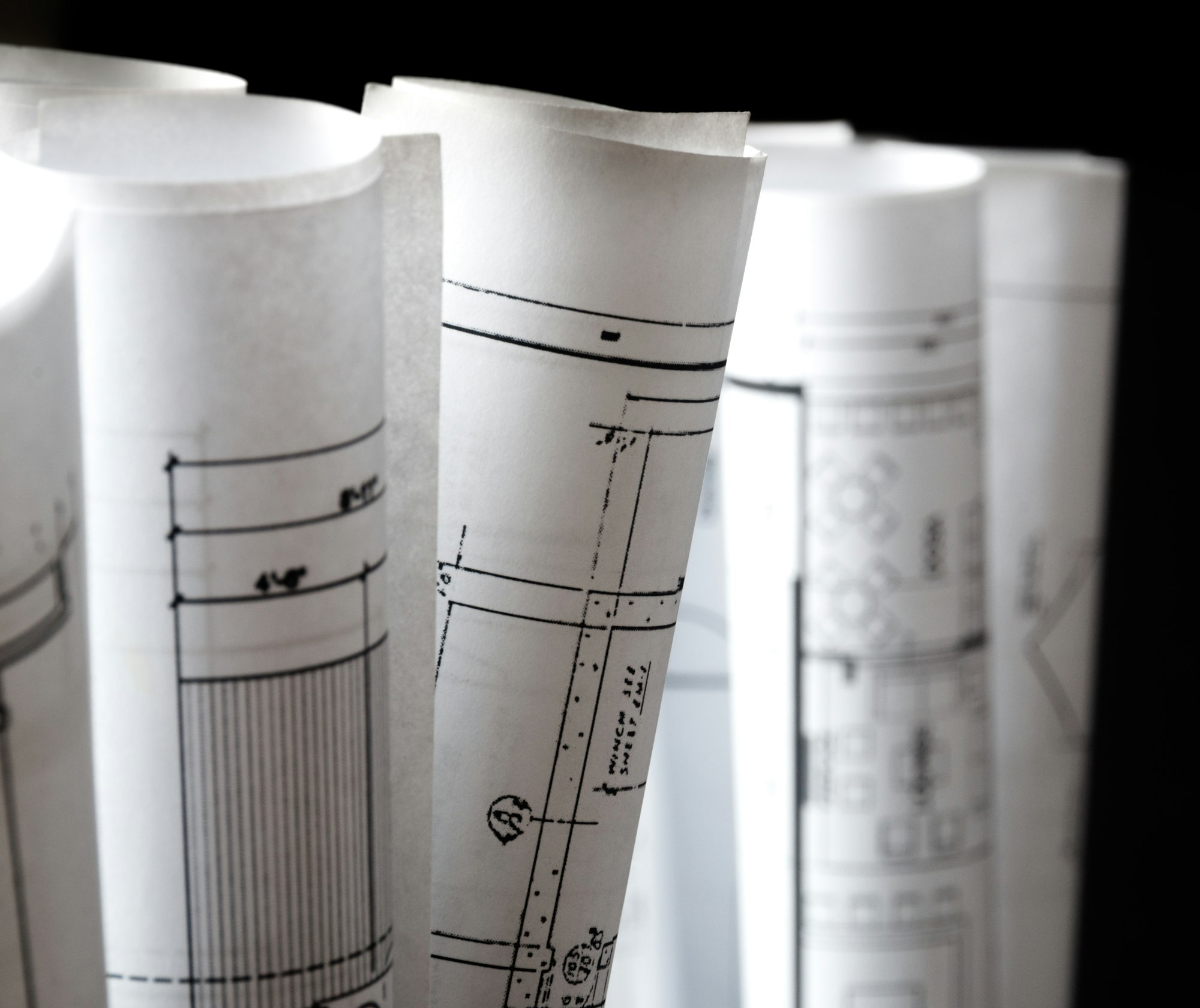 rolls of architecture blueprints and house plans